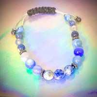 a bracelet with blue and silver beads